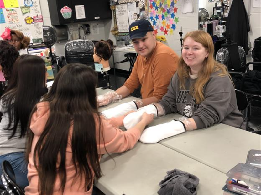 Centennial High cosmetology students style hair